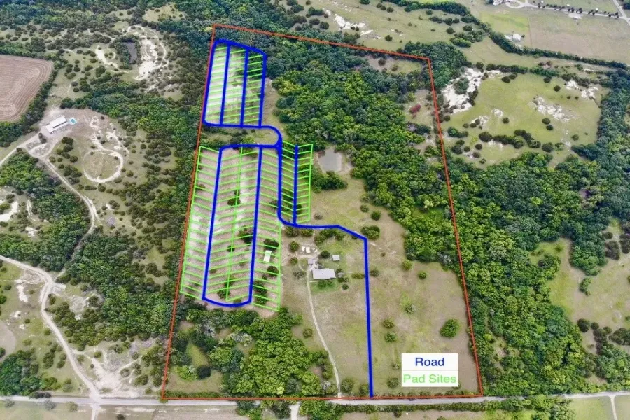 Aerial overview of property's location featuring property parcel outlined