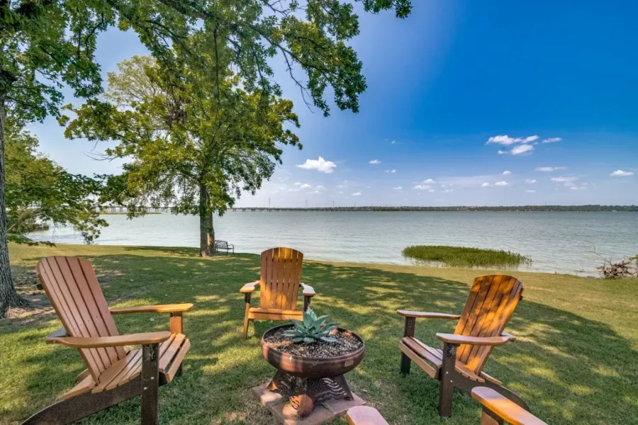 View of green lawn with a water view