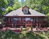 Ranch-style residence featuring a prominent covered porch extending across the front façade