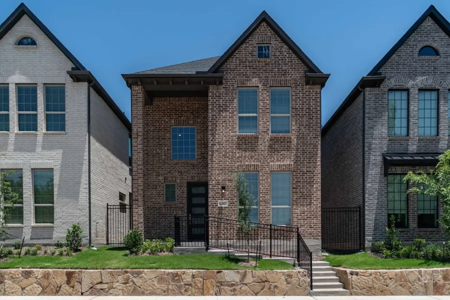 Brick facade residence with a gabled roofline