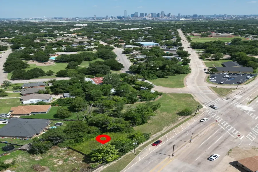 Cleared lot with green space, mature trees, and street frontage