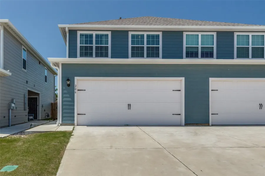 Garage featuring driveway