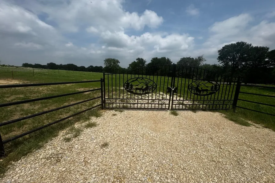 Frontage to HWY 56 with nice drive way and piped fence