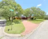 View of front of house with a front lawn and concrete driveway