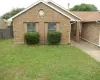 Single story home with brick siding