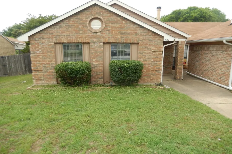 Single story home with brick siding