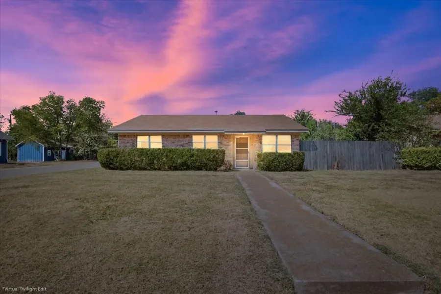 Single story home featuring brick siding