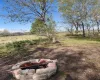 View of yard featuring an outdoor fire pit