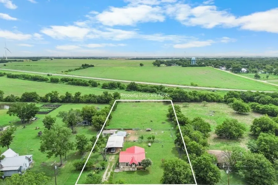 Overview of rural landscape featuring property boundaries highlighted and agricultural land