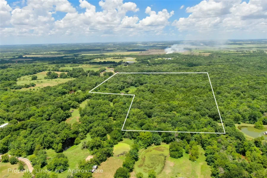 Aerial overview of property's location with property parcel outlined