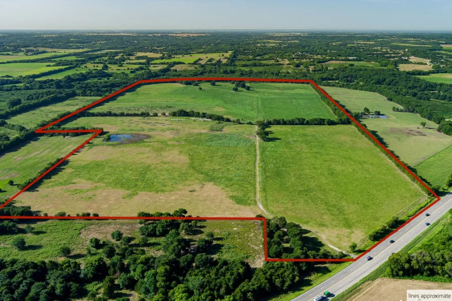 Overview of rural landscape with property parcel outlined and agricultural land