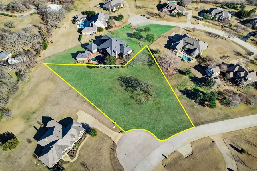 Aerial view of residential area with property boundaries highlighted