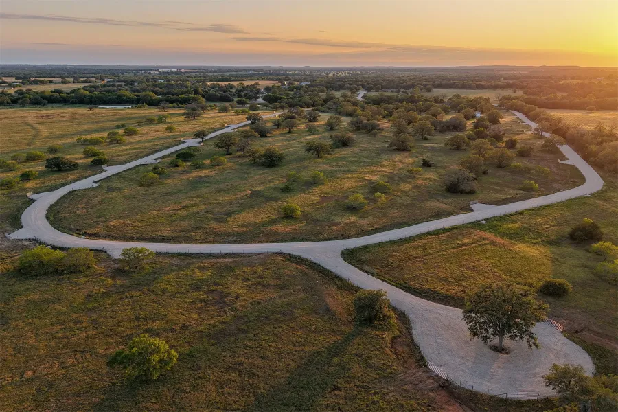 Aerial view of property and surrounding area featuring rural landscape