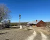 Beautifully Loved 24.95 acres 2 homes, 2 tanks, barn and working windmill