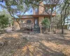 Hill Country home for sale in Canyon Lake TX on shaded 0.34 acre lot with mature trees